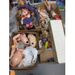 Four boxes containing a large quantity of soft toys, composite dolls etc