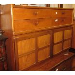 Nathan Furniture dining suite comprising: sideboard with four short drawers above panelled doors,