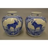 Pair of 19th Century Chinese blue and white ovoid jars decorated with unusual scenes of deer and
