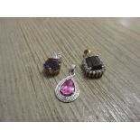 Group of three 9ct gold pendants set sapphire, amethyst and a pink stone
