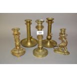 Five various ormolu and brass candlesticks