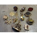 Quantity of various 9ct gold mounted fob seals, pendants and charms together with three unmarked