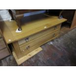Modern light oak rectangular coffee table / two drawer chest together with an early 20th Century