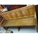 Late 19th / early 20th Century mahogany hall bench having panelled back, raised on turned supports