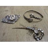 Silver brooch in the form of a dogs head, white metal bangle and a moonstone set brooch in the