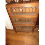 Small oak and leaded glass three door bookcase