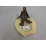 Brown patinated bronze figure of Pierrot mounted on an alabaster ashtray base