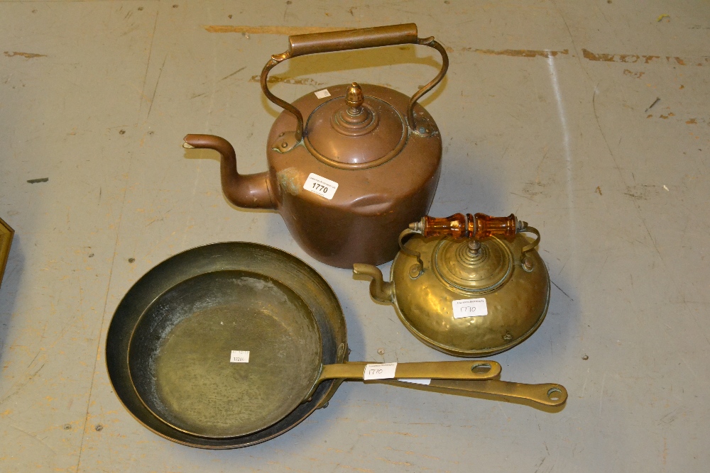 Antique copper kettle, two copper and brass frying pans and a brass kettle