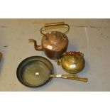 Antique copper kettle, two copper and brass frying pans and a brass kettle