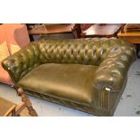 19th Century green leather button upholstered two seat Chesterfield type drop end sofa on mahogany