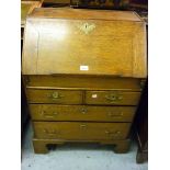 Small 18th Century oak bureau, the fall front enclosing a fitted interior with well above two