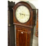 19th Century mahogany and inlaid longcase clock with an arched hood above rectangular panel door,