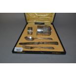 Silver Christening mug, napkin ring, knife, fork and associated spoon in a fitted case