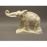 Large French Art Deco pottery figure of an elephant, inscribed 'Dolly' (chip to rim)