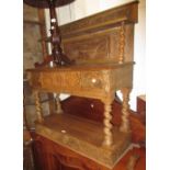 19th Century oak side table, the shelf back above a single carved drawer raised on barley twist