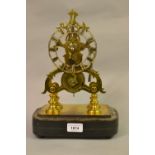 19th Century gilt brass skeleton clock, the silvered dial with Roman numerals with a single train