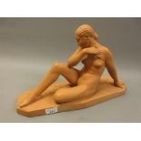 French terracotta figure of a seated nude female