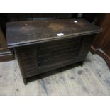 Small 20th Century oak coffer having carved decoration on stile end supports