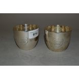 Pair of B.P. 1909 - 1959 commemorative silver beakers