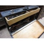 Black tool box containing a quantity of various antique tools including: chisels, moulding planes,