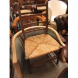 Child's beechwood ladder back chair with rush seat, together with a child's white painted tub chair