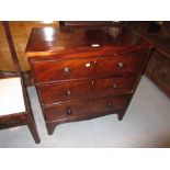 Early 19th Century straight front chest of three long graduated drawers with knob handles and