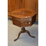 19th Century octagonal mahogany work box with hinged cover on turned column with cabriole and pad