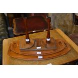 Two Danish Dansk teak trays, pair of Danish rosewood candlesticks and a teak book slide