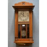 1920's Beechwood two train wall clock with silvered dial