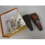 Victorian leather cased set of graduated steel sewing scissors, another tartan ware cased pair of