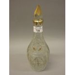 Early 19th Century French cut and etched glass decanter with stopper and gilded decoration Chip to