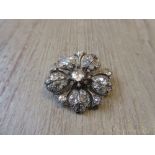 Late 19th Century multiple diamond set flower head brooch Generally in good condition with no breaks