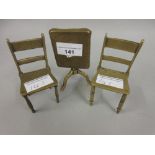 Brass Trench art miniature pedestal table and two chairs