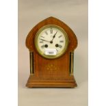 Edwardian mahogany and inlaid arch top mantel clock, the enamel dial with Roman numerals,
