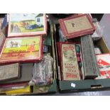 Two boxes containing a large quantity of childrens puzzles and other various board games and Meccano