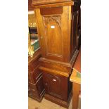 Pair of oak bedside cupboards with moulded tops above single Gothic arched panel doors