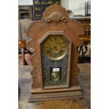19th Century American oak two train mantel clock with a painted glazed door