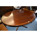 William Tillman, oval reproduction mahogany crossbanded and line inlaid tilt top dining table on