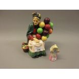 Royal Doulton figure, ' The Old Balloon Seller ' HN1315, together with a Royal Worcester candle