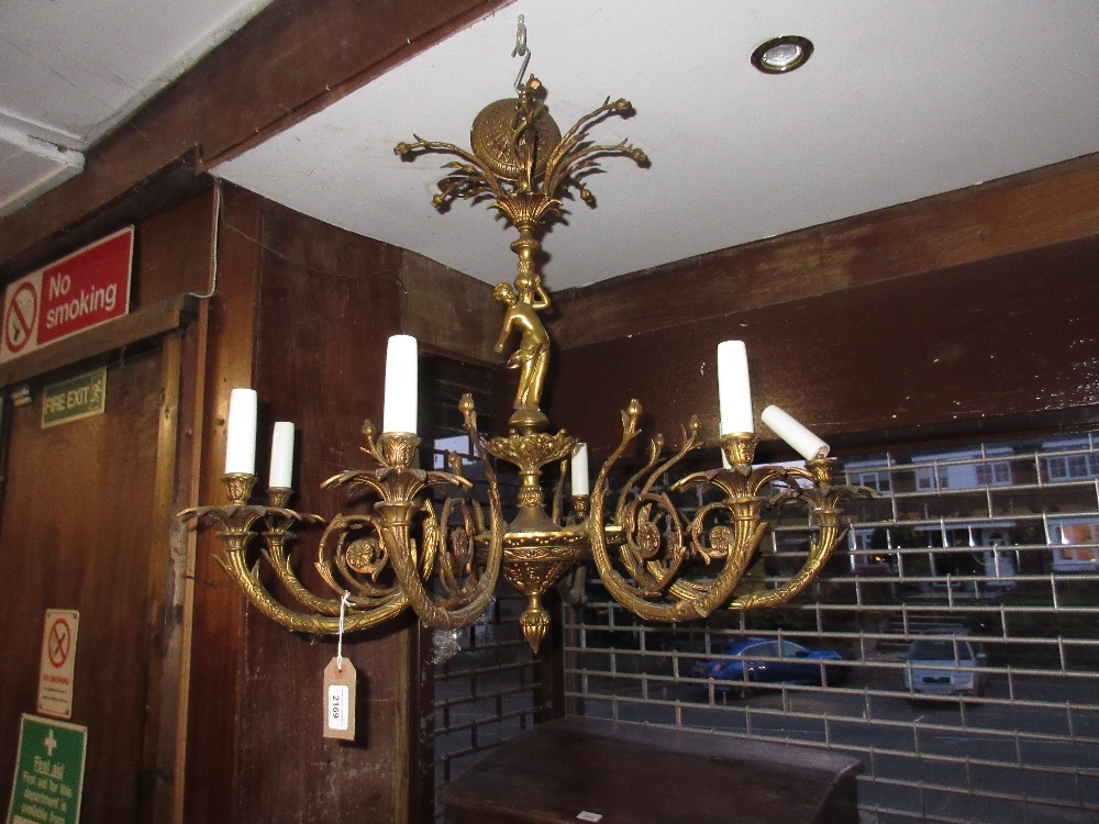 Mid 20th Century gilt brass eight light electrolier with figural column and a smaller three branch