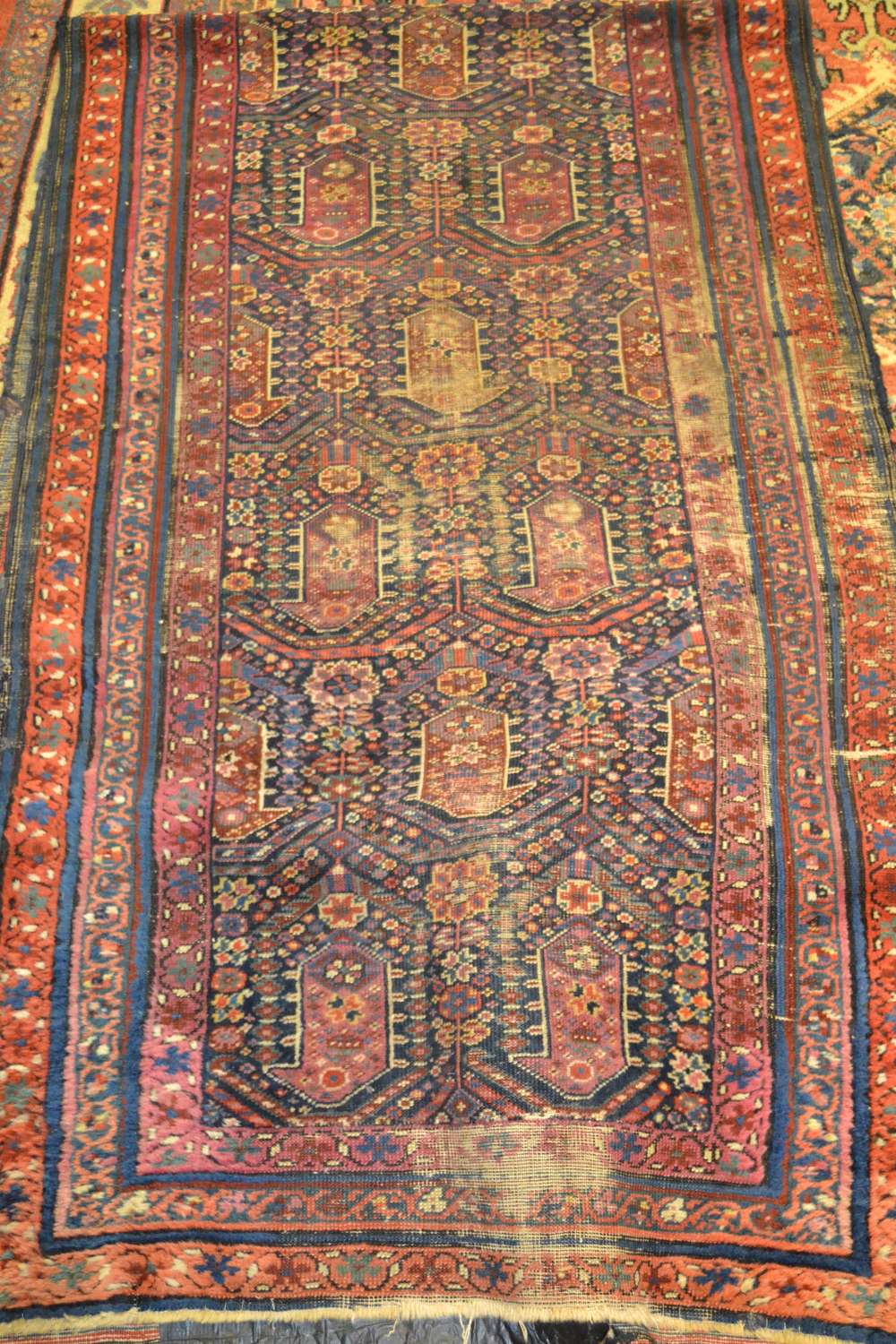 Hamadan runner with a repeating Boteh design on blue ground with borders (worn), 303cms x 89cms