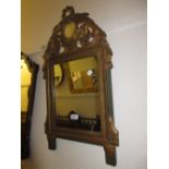 19th Century French carved and gilded wall mirror with a pierced floral surmount