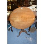 19th Century mahogany circular pedestal table with a vase turned column support and tripod base