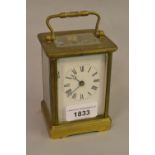 Small brass cased single train carriage clock