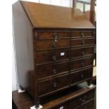 Early 20th Century mahogany bureau, the fall front enclosing a fitted interior above an