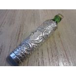 Edwardian embossed silver covered perfume bottle with green glass well and stopper