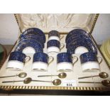 Set of six Copeland Spode blue and gilt coffee cans, together with six silver gilt coffee spoons