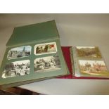 Two albums containing a quantity of various postcards