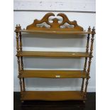 Late 19th Century stained beechwood four tier wall bracket with serpentine shaped shelves and