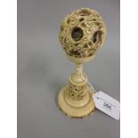 Late 19th / early 20th Century Chinese carved puzzle ball on a circular carved stand (at fault)